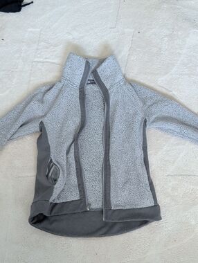 The North Face Women's Light Gray Teddy Fleece Jacket with Dark Gray Trim